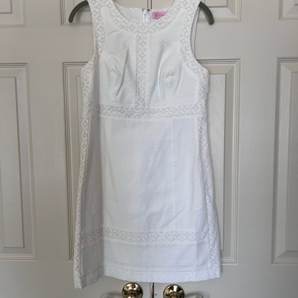Lilly Pulitzer white cotton shift dress with lace detail.
